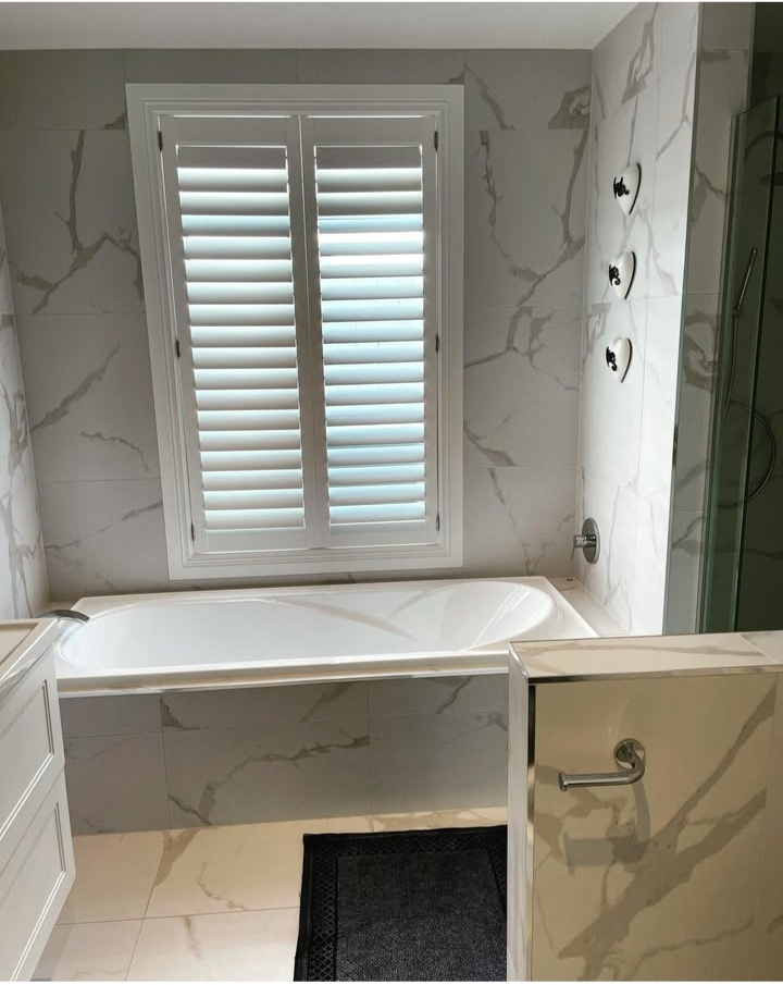 Modern walk-in shower with carefully installed subway tile walls